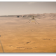 A mock-up of the helicopter in flight over Jezero Crater on Mars.